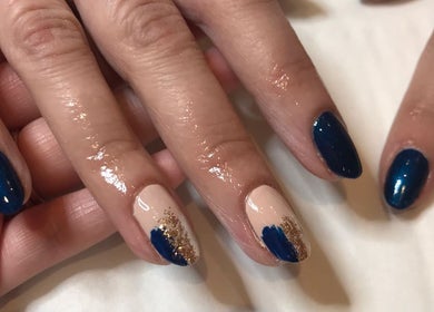 Stylish blue and gold nail art at The Brookside Hair, Barber & Beauty Salon, Darwen, England, GB.