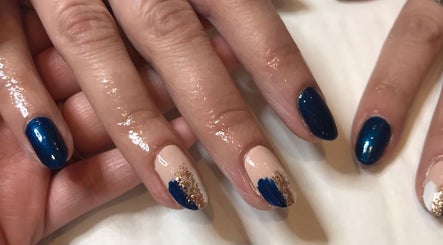 Stylish blue and gold nail art at The Brookside Hair, Barber & Beauty Salon, Darwen, England, GB.