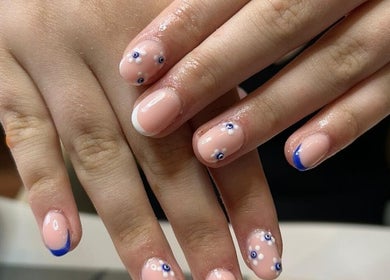 Elegant floral nail art at The Brookside Hair, Barber & Beauty Salon in Darwen, England, GB.