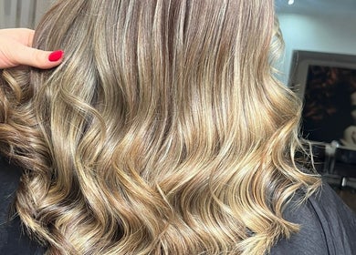 Glossy wavy hairstyle at The Brookside Hair, Barber & Beauty Salon, Darwen, England, GB.