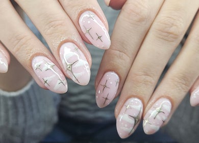Elegant nail art with stars and pink polish at Lucky Frog Nails, Newton Abbot, England, GB.