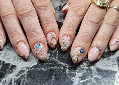 Intricate gemstone nail art at Lucky Frog Nails, Newton Abbot, England, GB showcasing elegant and refined beauty.