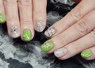Colorful nail art with intricate designs at Lucky Frog Nails, Newton Abbot, England, GB.