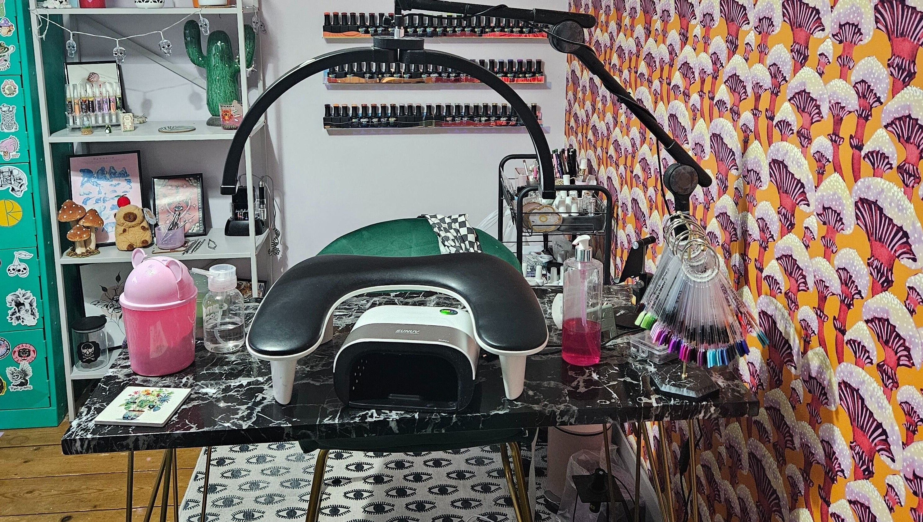 Lucky Frog Nails in Newton Abbot, England features a stylish nail art station with vibrant decor.