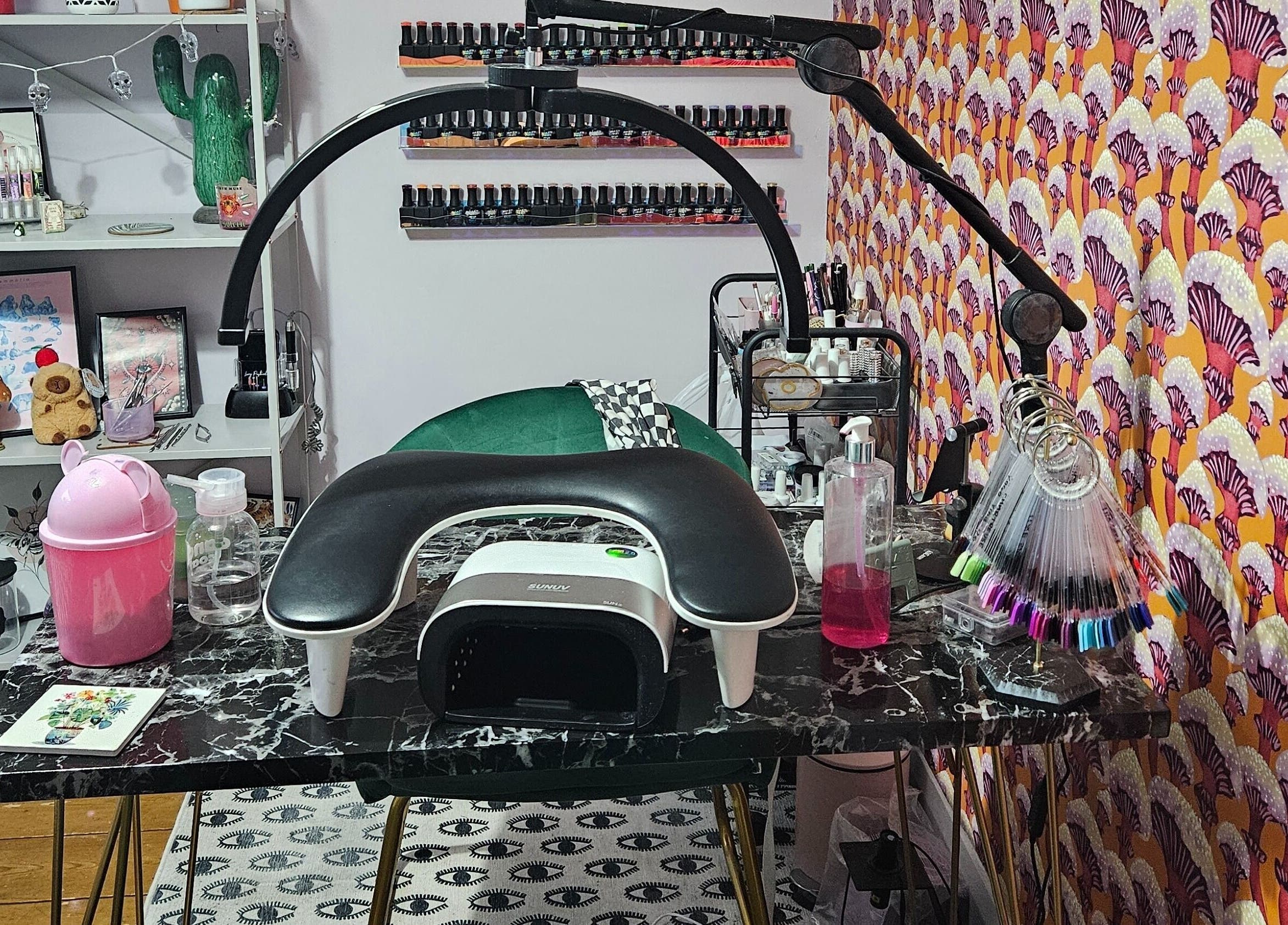 Lucky Frog Nails in Newton Abbot, England features a stylish nail art station with vibrant decor.