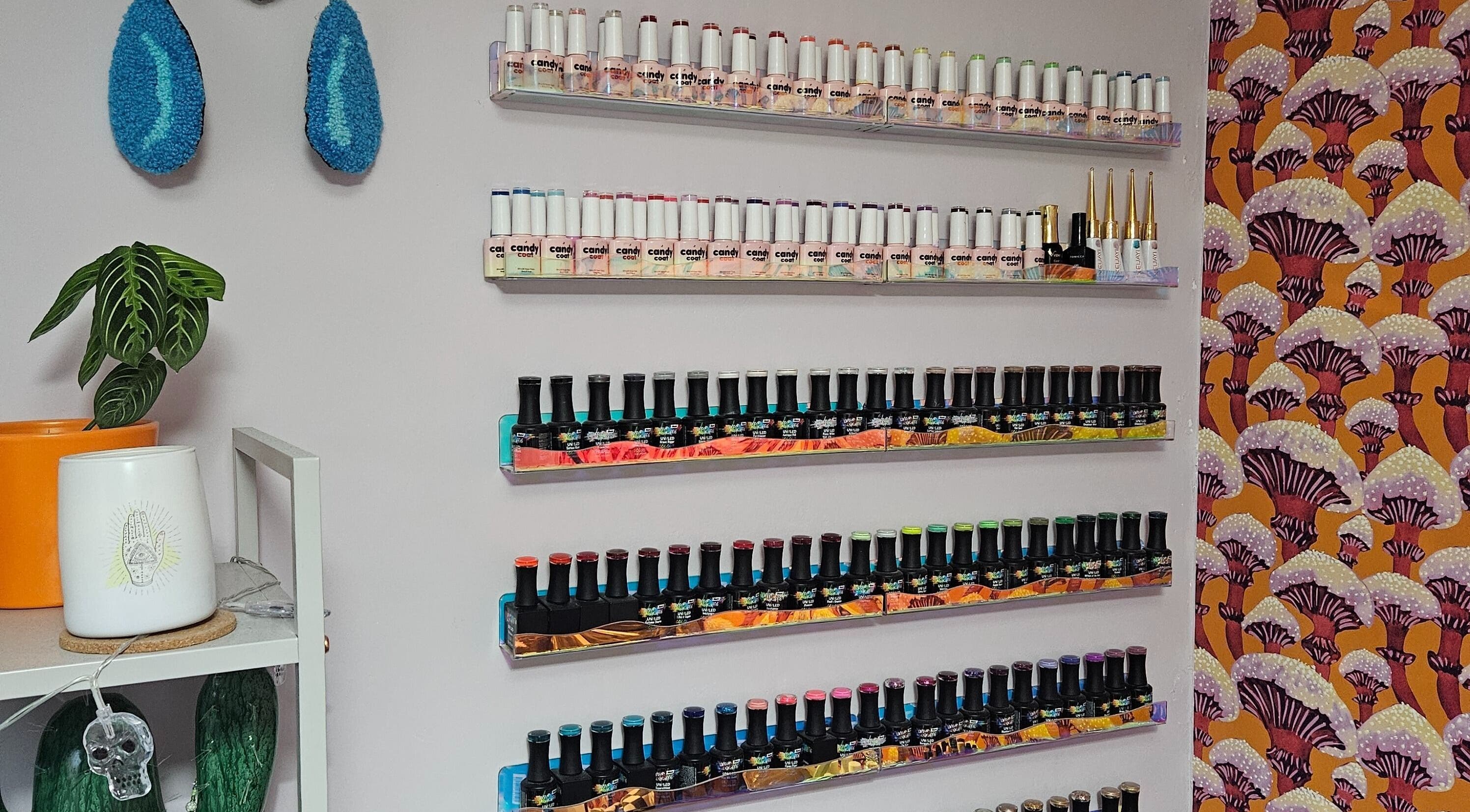Colorful nail polish shelves at Lucky Frog Nails in Newton Abbot, England, GB.