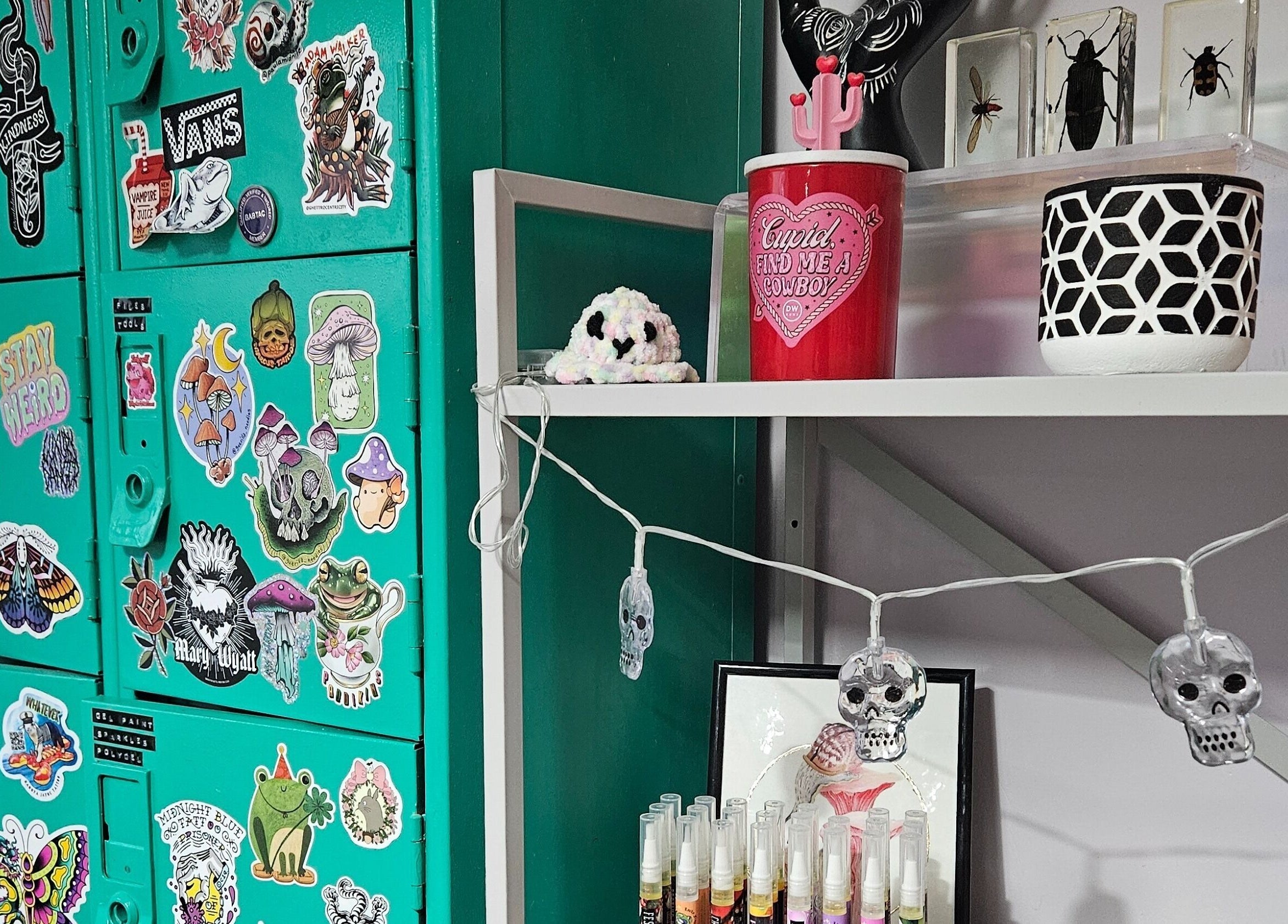Eclectic sticker-covered lockers and decor at Lucky Frog Nails, Newton Abbot, England, GB.