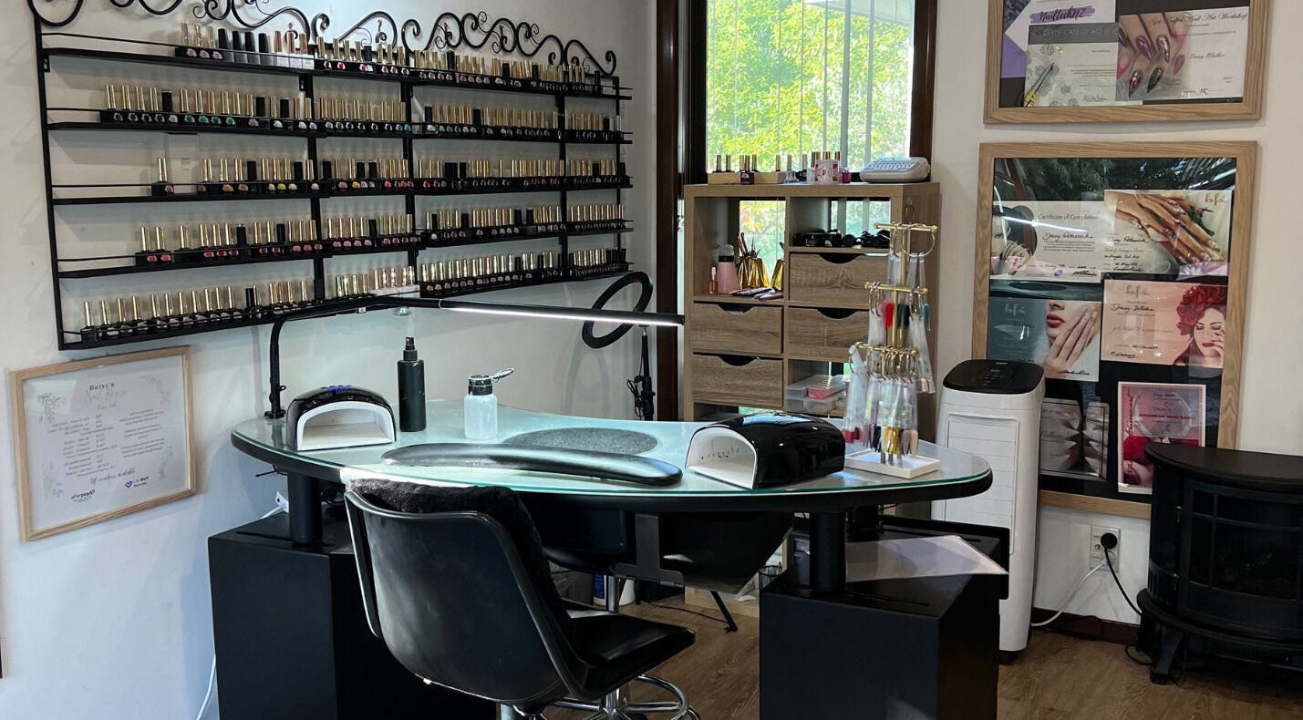 Nail workstation at Daisy's Nail Artistry - Christchurch in Christchurch, Canterbury, NZ. Elegantly organized polishes.