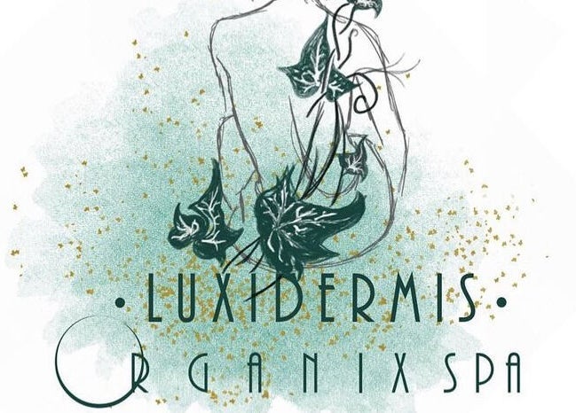 Artistic logo for Luxidermis Organix in Portmore, St. Catherine Parish, JM, featuring lush green ivy and gold flecks.