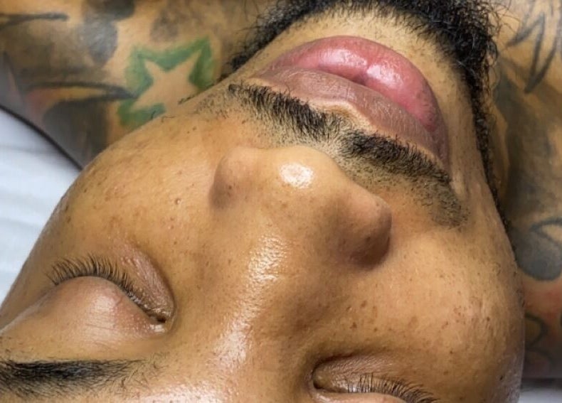 Close-up of a relaxed face at Luxidermis Organix, Portmore, St. Catherine Parish, JM, showcasing a serene spa experience.