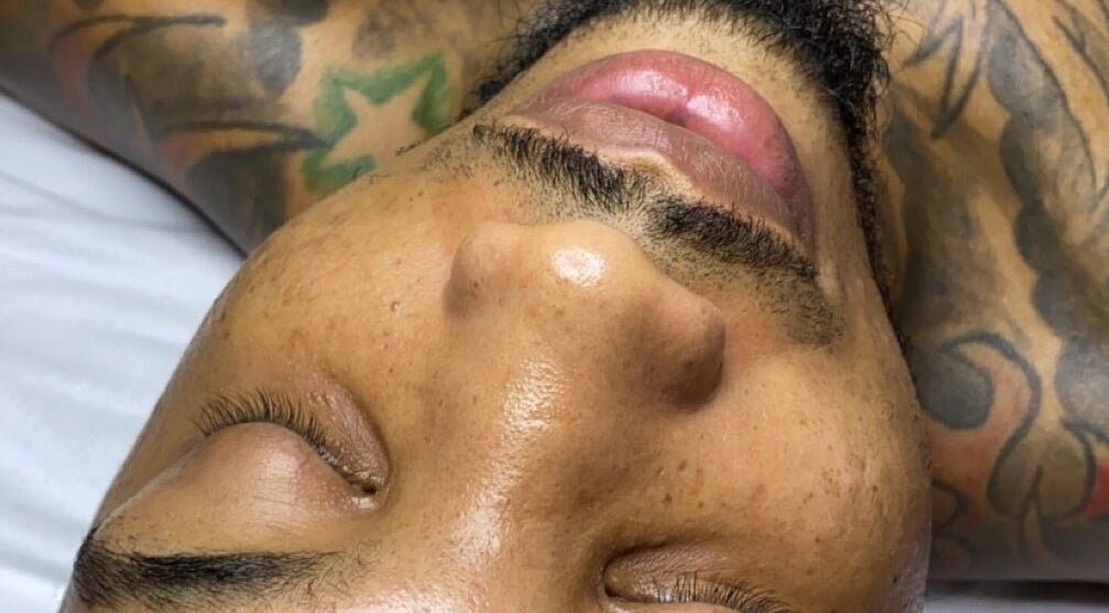 Close-up of a relaxed face at Luxidermis Organix, Portmore, St. Catherine Parish, JM, showcasing a serene spa experience.