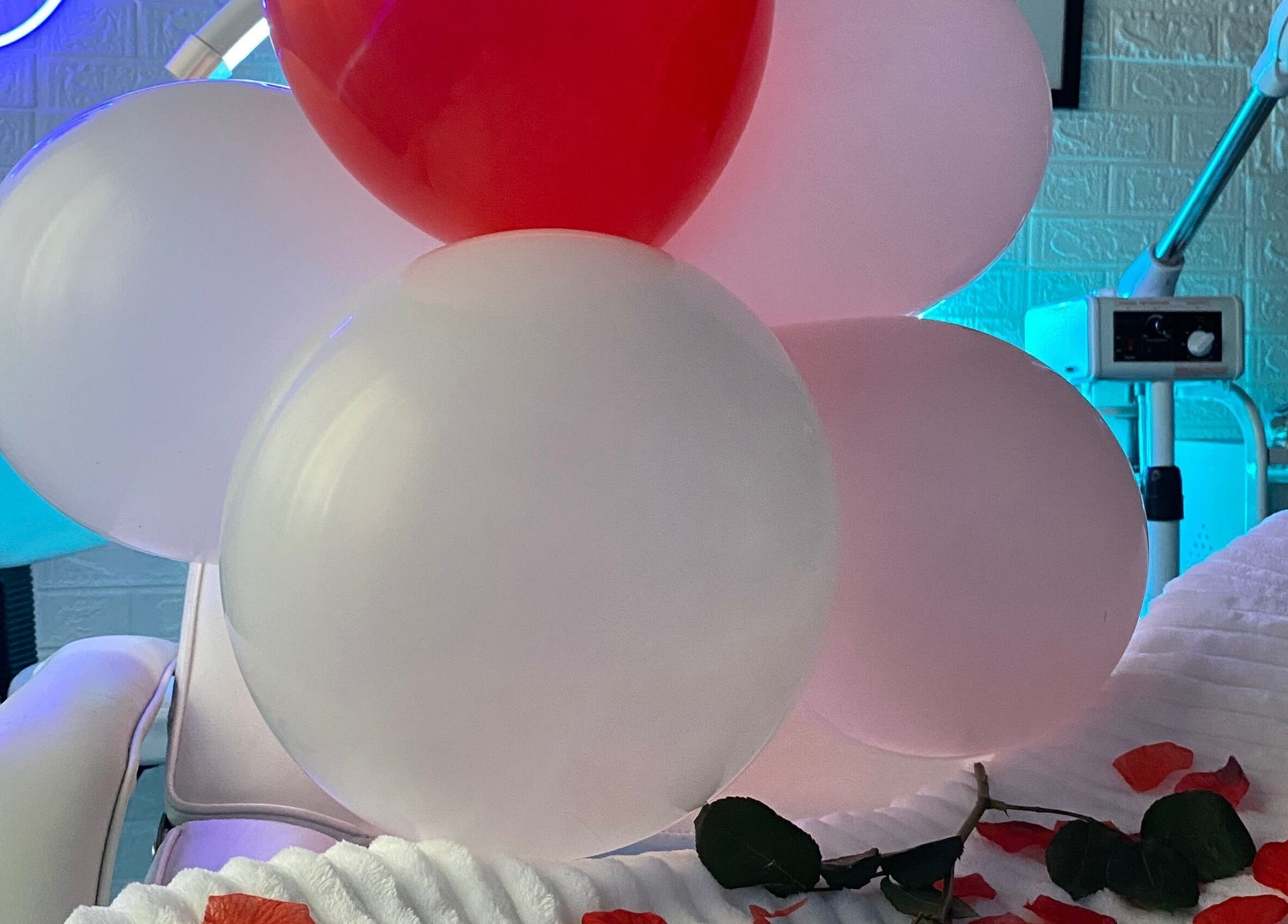 Luxidermis Organix beauty room with balloons, rose petals, Portmore, St. Catherine Parish, JM.