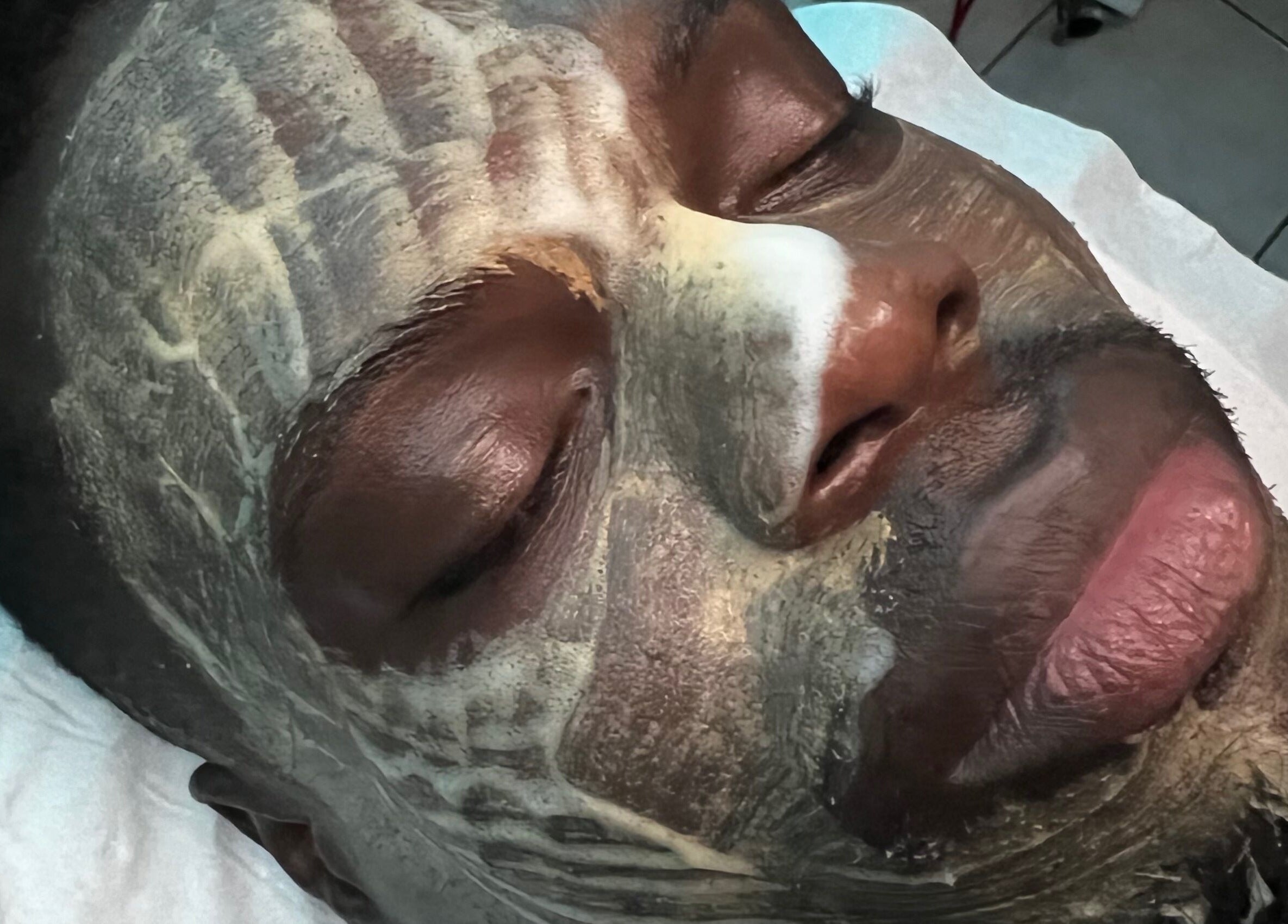 Relaxing facial treatment at Luxidermis Organix in Portmore, St. Catherine Parish, JM, featuring nourishing masks.