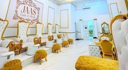 Luxurious interior of Jaas Nails and Beauty in Cebu City, Central Visayas, PH with golden chairs and footrests.