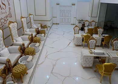 Elegant interior of Jaas Nails and Beauty in Cebu City, Central Visayas, PH, featuring plush seats and manicure tables.