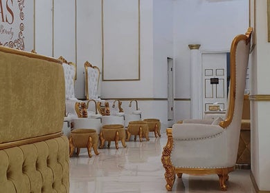 Elegant gold and white chairs at Jaas Nails and Beauty in Cebu City, Central Visayas, PH for a royal experience.