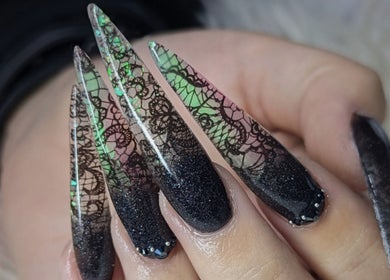 Stylish long nails with intricate lace pattern at Kel's Nailz, Bristol, England, GB.