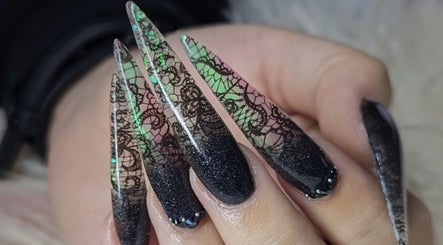 Stylish long nails with intricate lace pattern at Kel's Nailz, Bristol, England, GB.