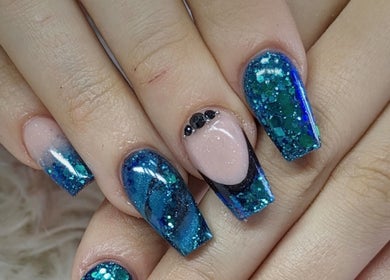 Elegant blue glitter nails with rhinestones at Kel's Nailz, Bristol, England, GB.