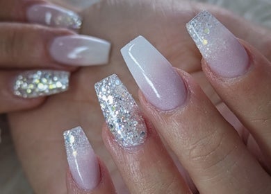 Glittery ombre nails design at Kel's Nailz, Bristol, England, GB, showcasing elegant manicure style.