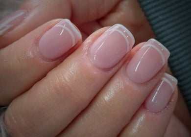 Close-up of elegant French nails at Kel's Nailz, Bristol, England, GB.