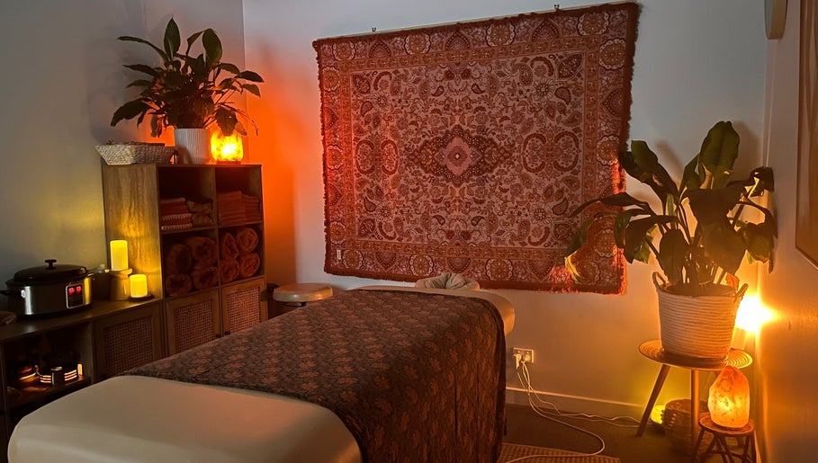 Lomi Massage Geelong in Newtown, Victoria, AU offers a serene, cozy massage room with warm lighting and decor.