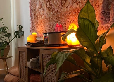 Relaxing massage room at Lomi Massage Geelong, Newtown, Victoria, AU with warm lighting and lush plants.