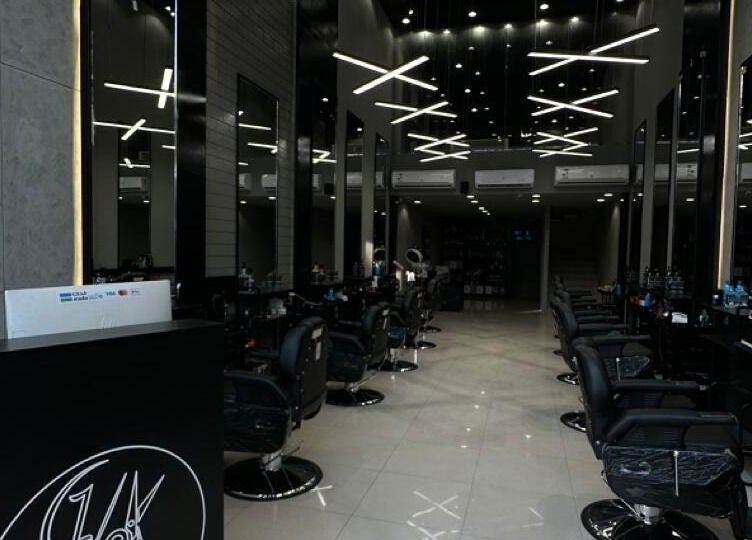 Interior of 1/2 Cuts Salon صالون هاف كت | Al Aziziyah in Riyadh shows sleek, modern decor.