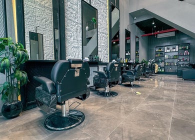 Modern interior of 1/2 Cuts Salon صالون هاف كت | Al Dammam, showcasing sleek styling chairs and decor in Dammam, Eastern Province, SA.