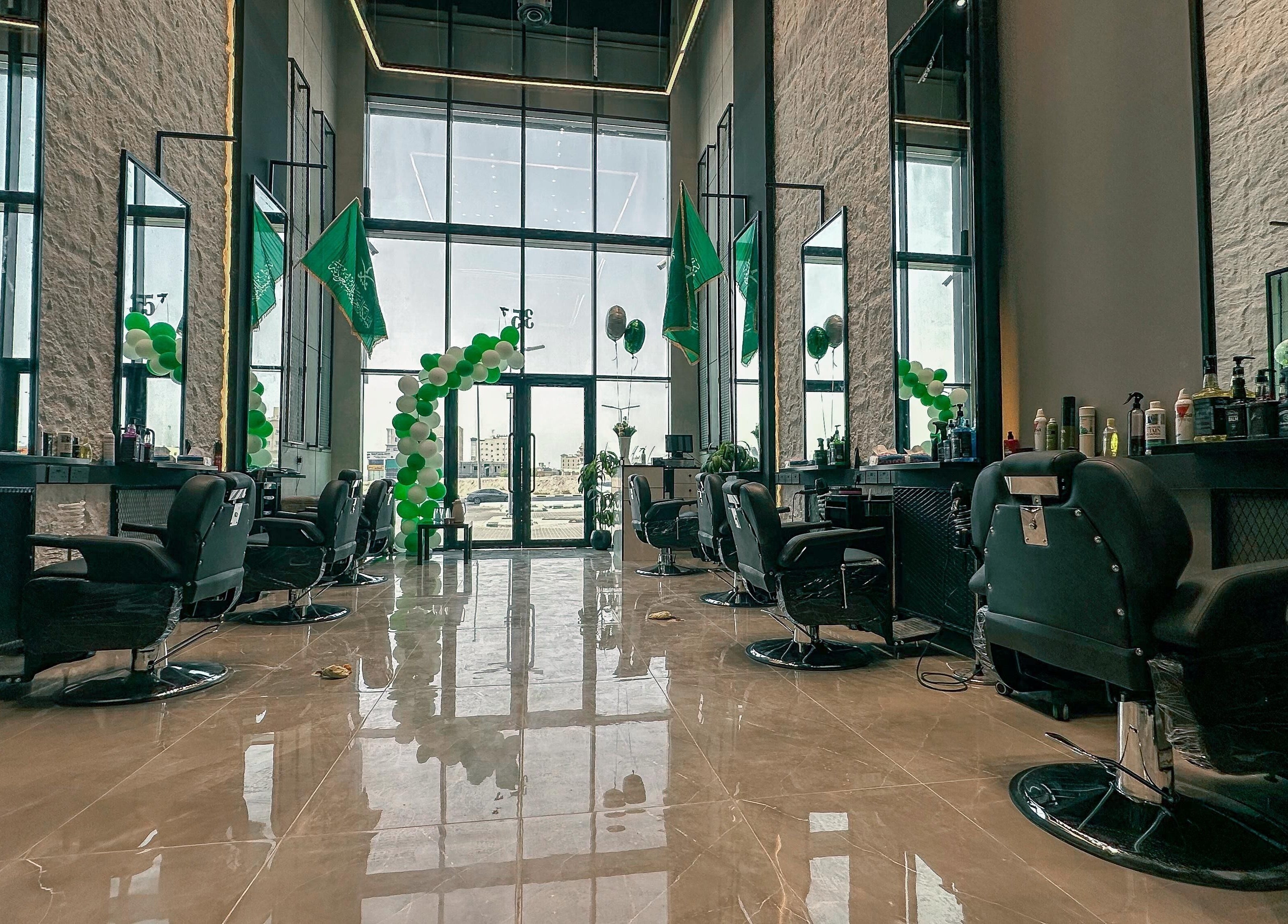 Modern interior of 1/2 Cuts Salon صالون هاف كت | Al Dammam, Dammam, Eastern Province, SA with barber chairs.