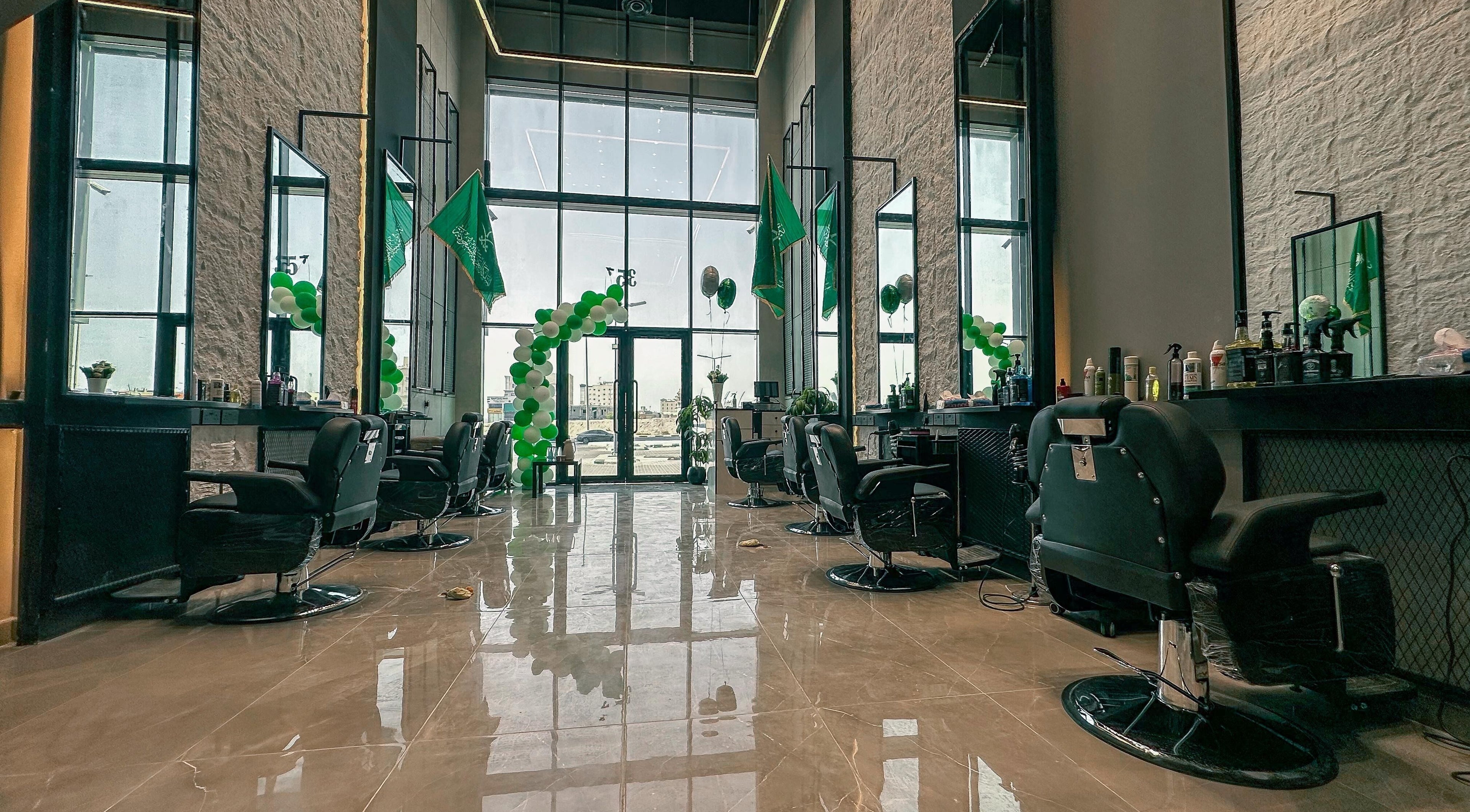 Modern interior of 1/2 Cuts Salon صالون هاف كت | Al Dammam, Dammam, Eastern Province, SA with barber chairs.