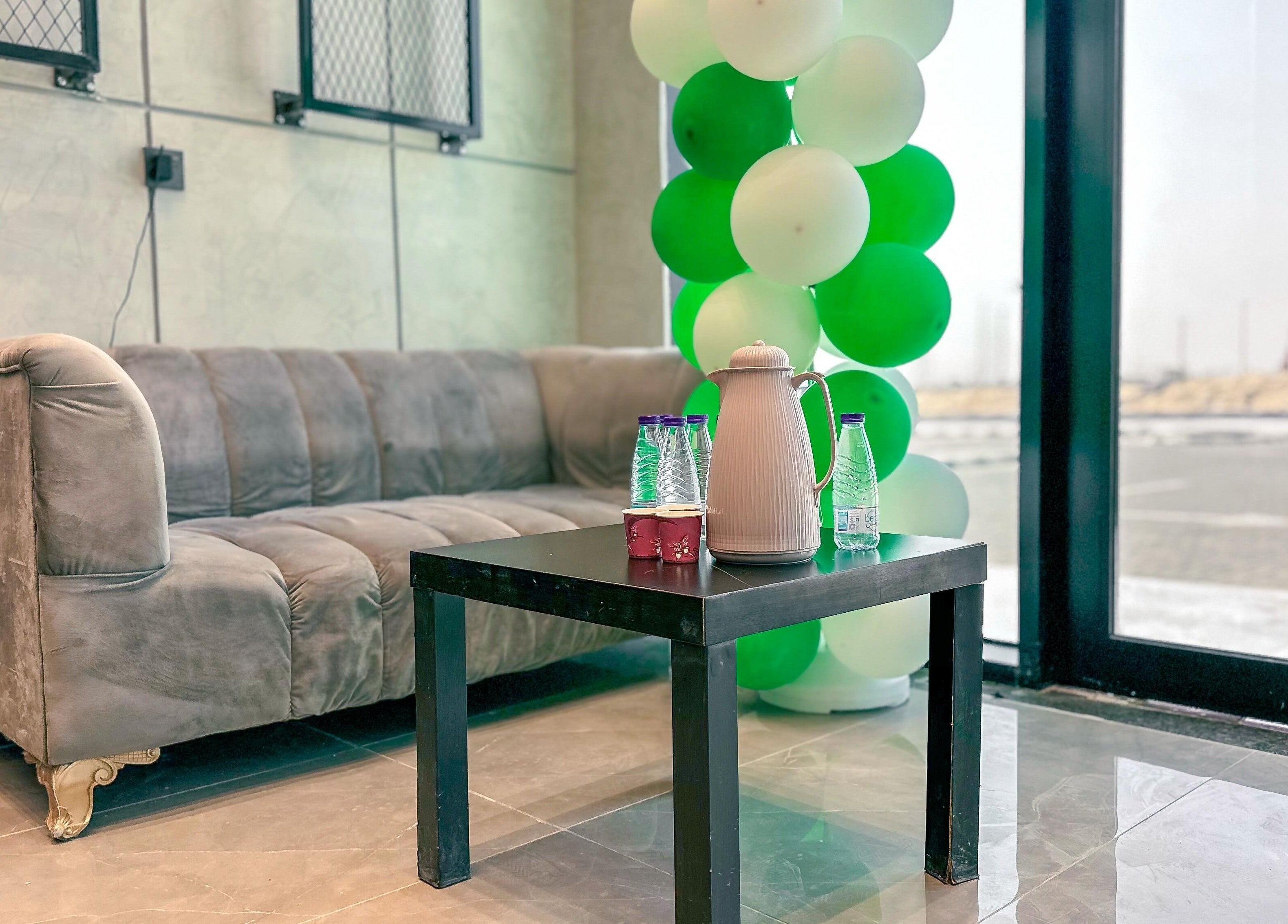 Relaxing sofa area at 1/2 Cuts Salon صالون هاف كت | Al Dammam, Dammam, Eastern Province, SA, with refreshments.