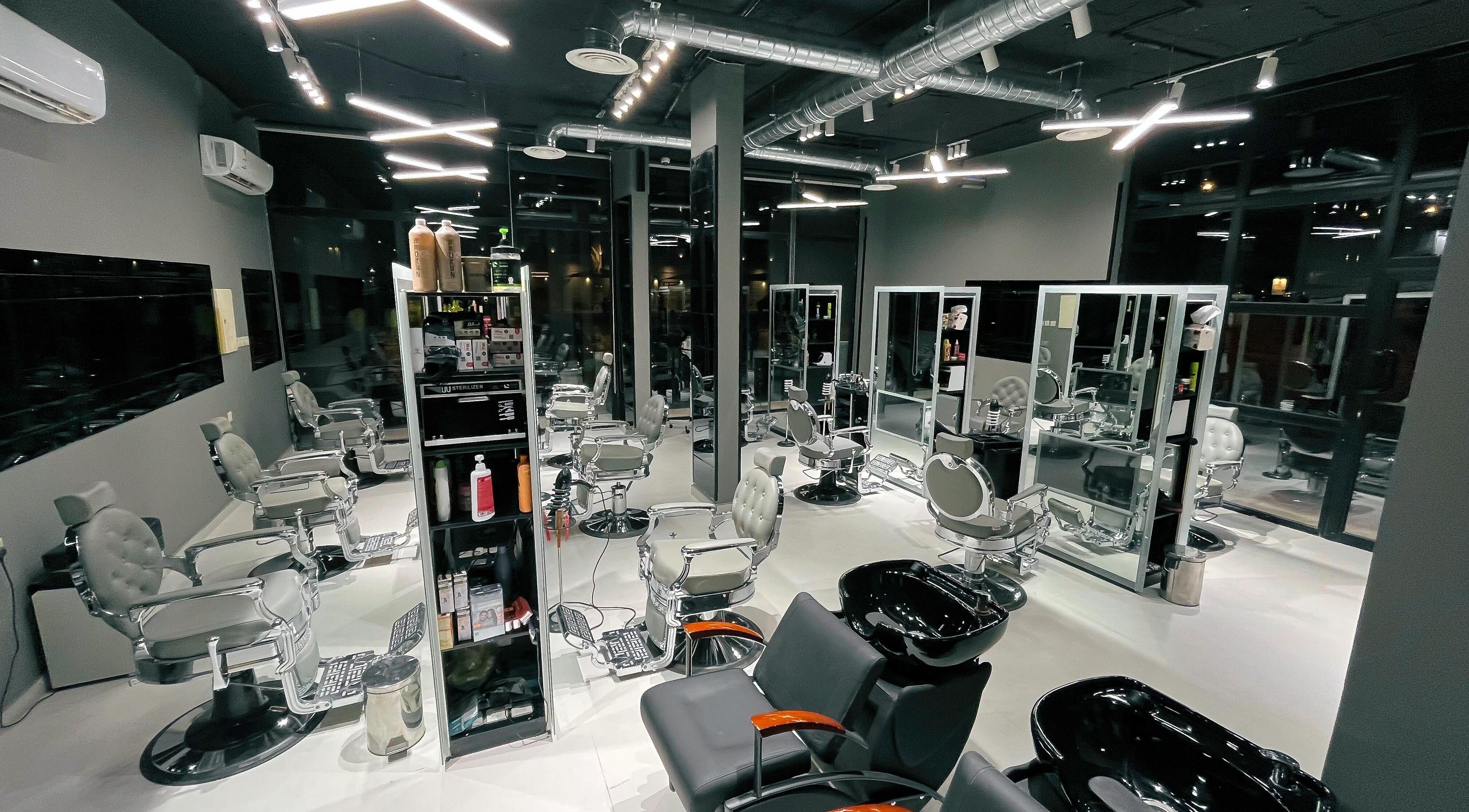 Modern interior of 1/2 Cuts Salon صالون هاف كت | Al Narjis in Riyadh, Riyadh Province, SA with sleek styling chairs.
