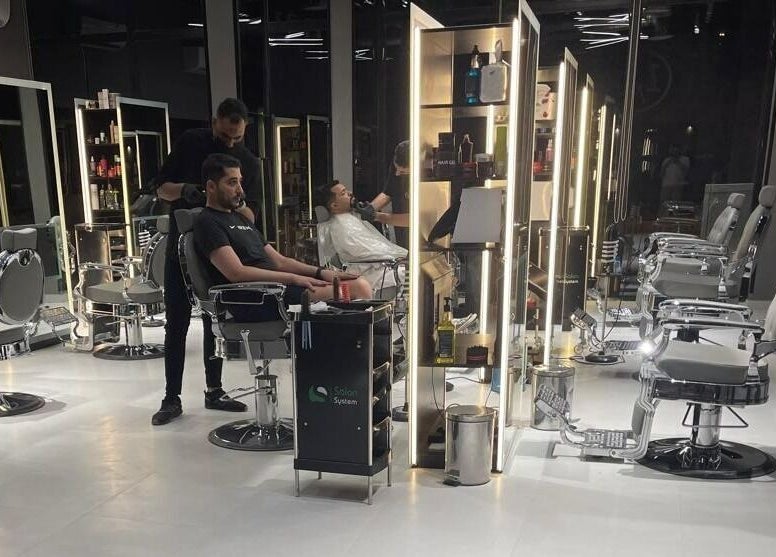 Interior of 1/2 Cuts Salon صالون هاف كت | Al Narjis, Riyadh showcasing hairstyling stations in Riyadh Province, SA.