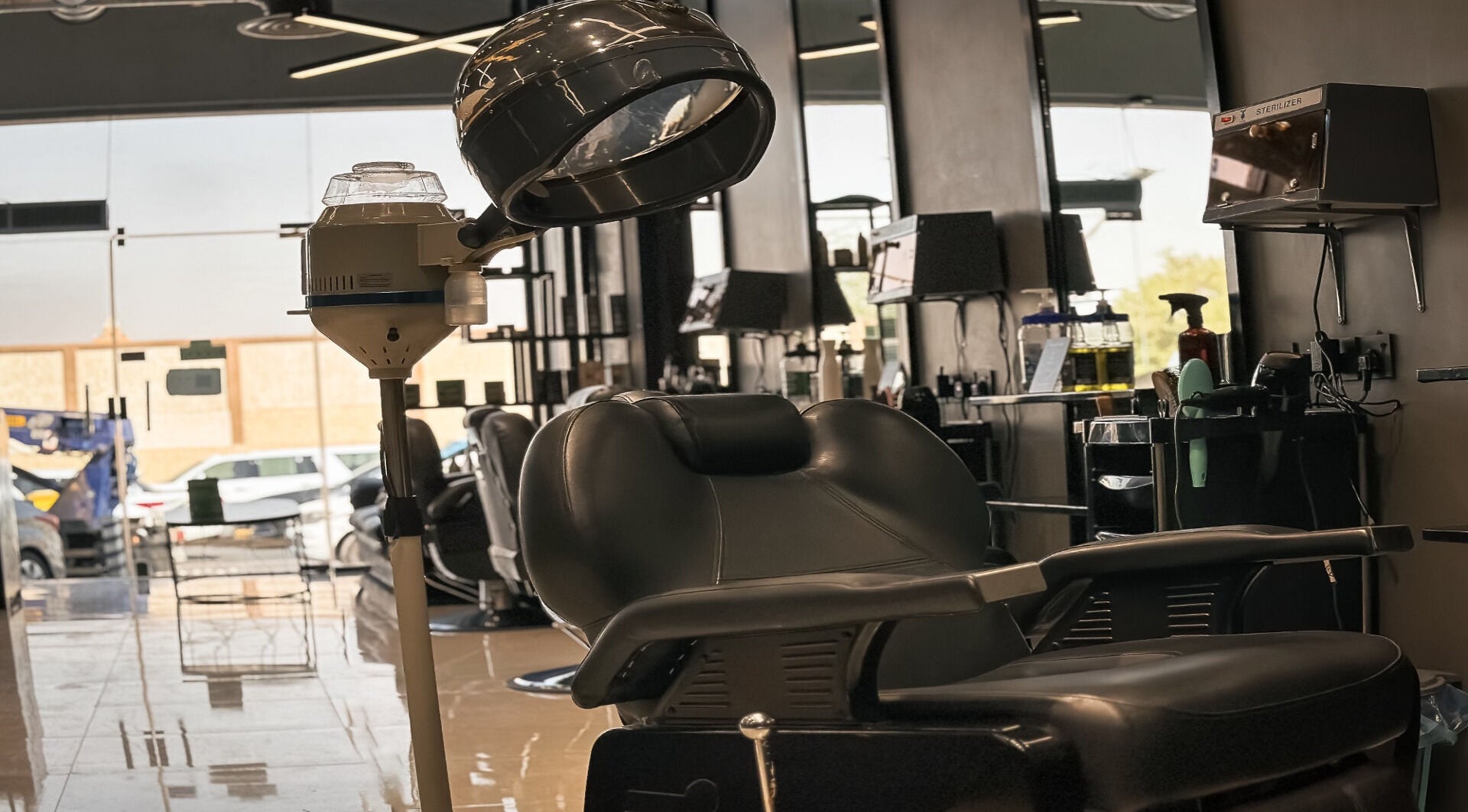 Modern salon interior with sleek styling chair at 1/2 Cuts Salon صالون هاف كت | Al Shifa, Riyadh, Riyadh Province, SA.