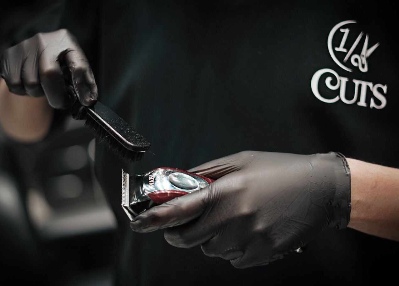 Professional clippers being cleaned at 1/2 Cuts Salon صالون هاف كت | Al Shifa, Riyadh, Riyadh Province, SA.