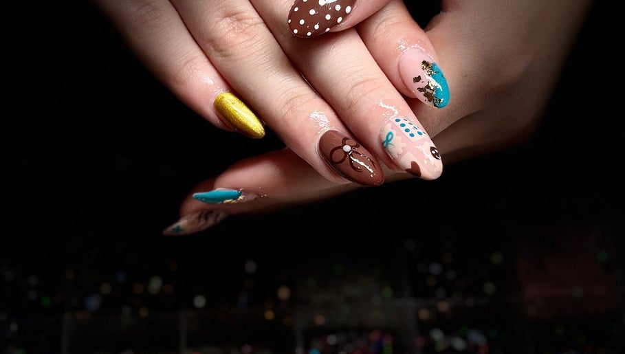 Colorful nail art design at Nails by Lauren in Live Oak, Florida, US showcasing intricate patterns.