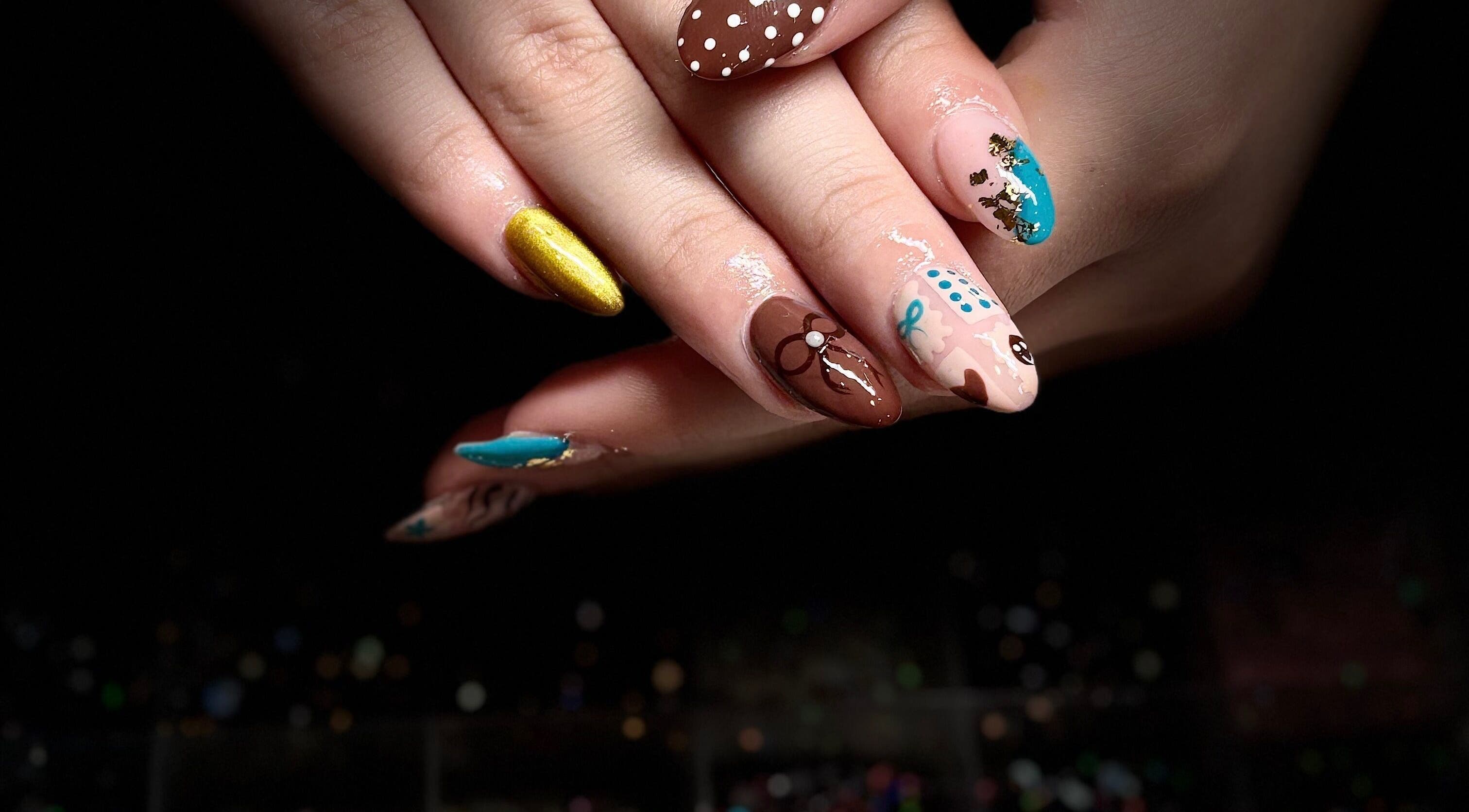 Colorful nail art design at Nails by Lauren in Live Oak, Florida, US showcasing intricate patterns.