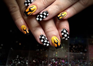 Stylish flame and checkered nail art at Nails by Lauren, Live Oak, Florida, US.