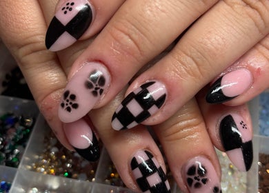 Elegant black and pink nail design at Nails by Lauren, Live Oak, Florida, US showcasing detailed artistry.