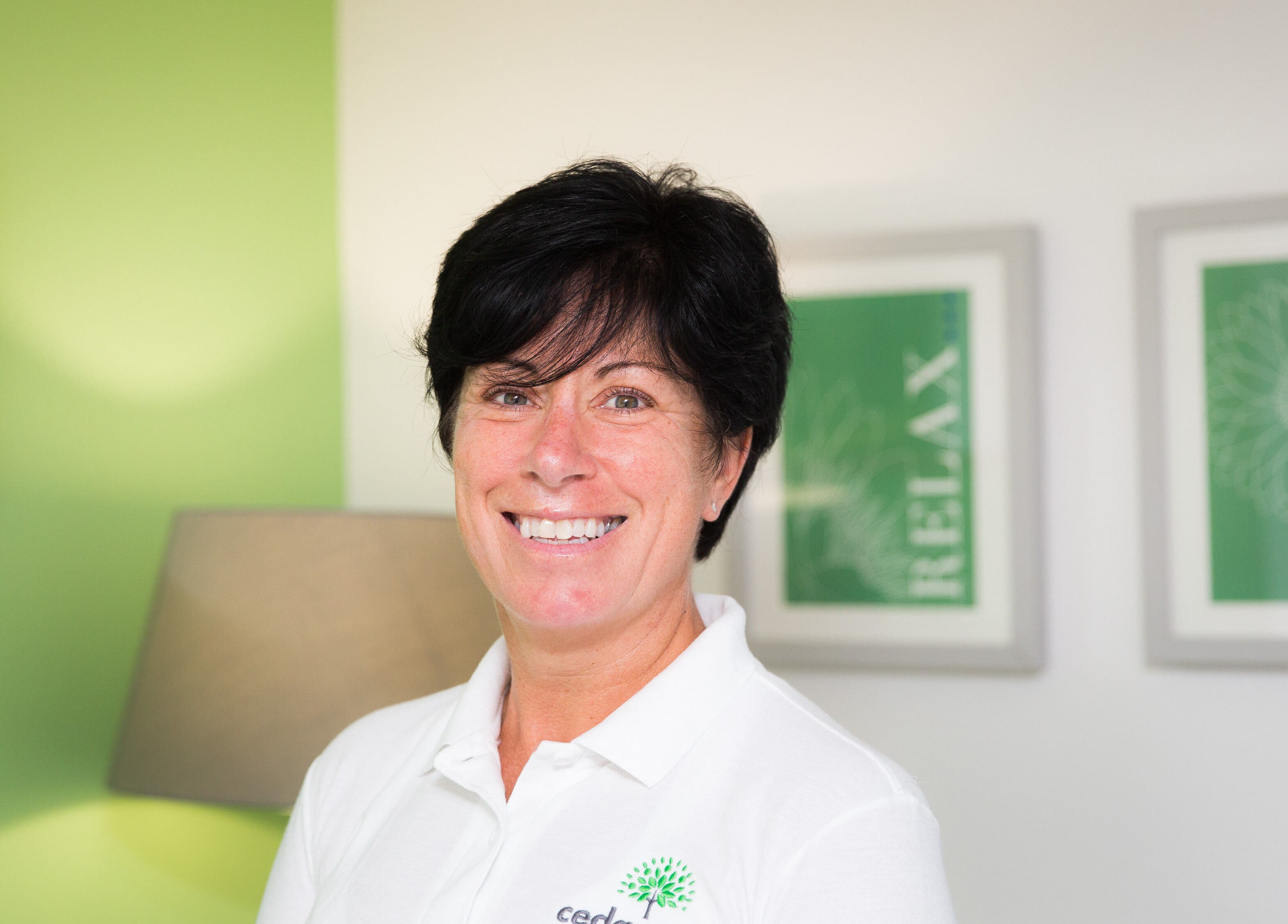 Helen Wright Sports Massage Therapist in Derby, GB, smiling with a relaxing studio background.