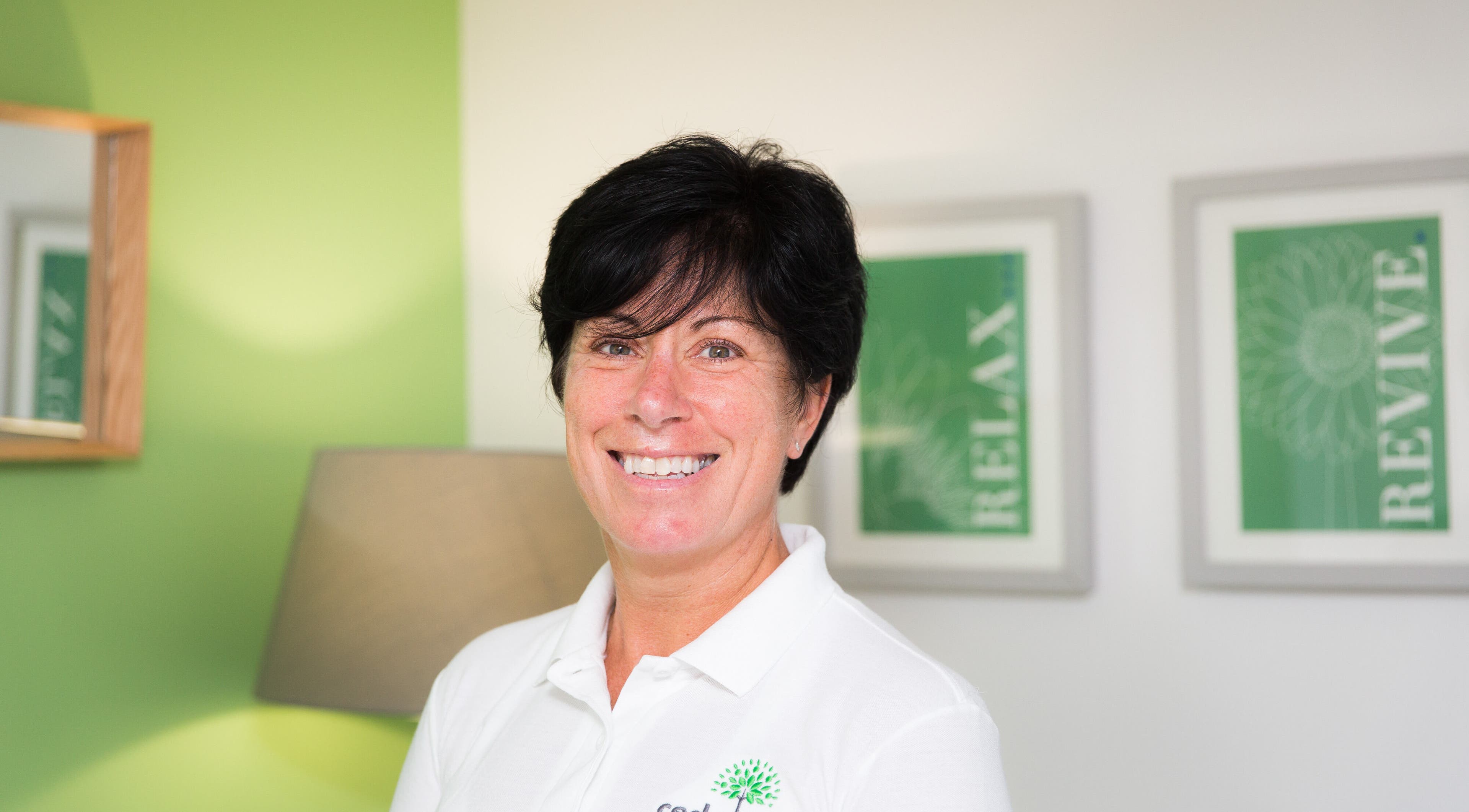 Helen Wright Sports Massage Therapist in Derby, GB, smiling with a relaxing studio background.