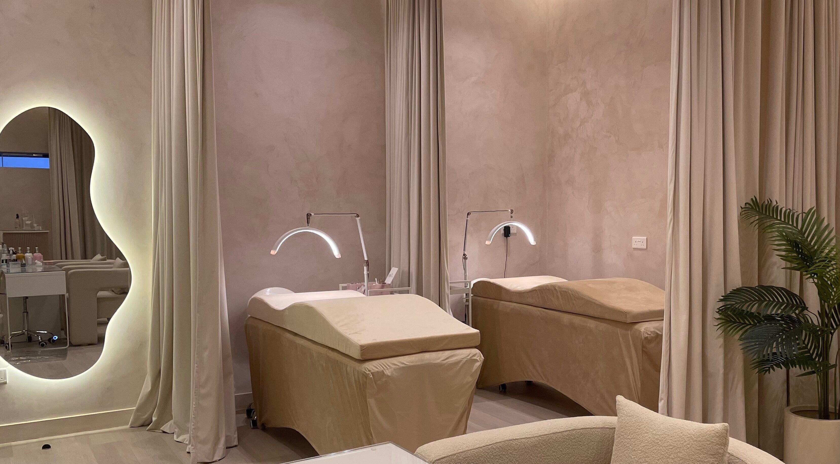 Relaxing treatment rooms at LBK Paris Beauty Salon in Dubai, AE, featuring plush beds and modern decor.