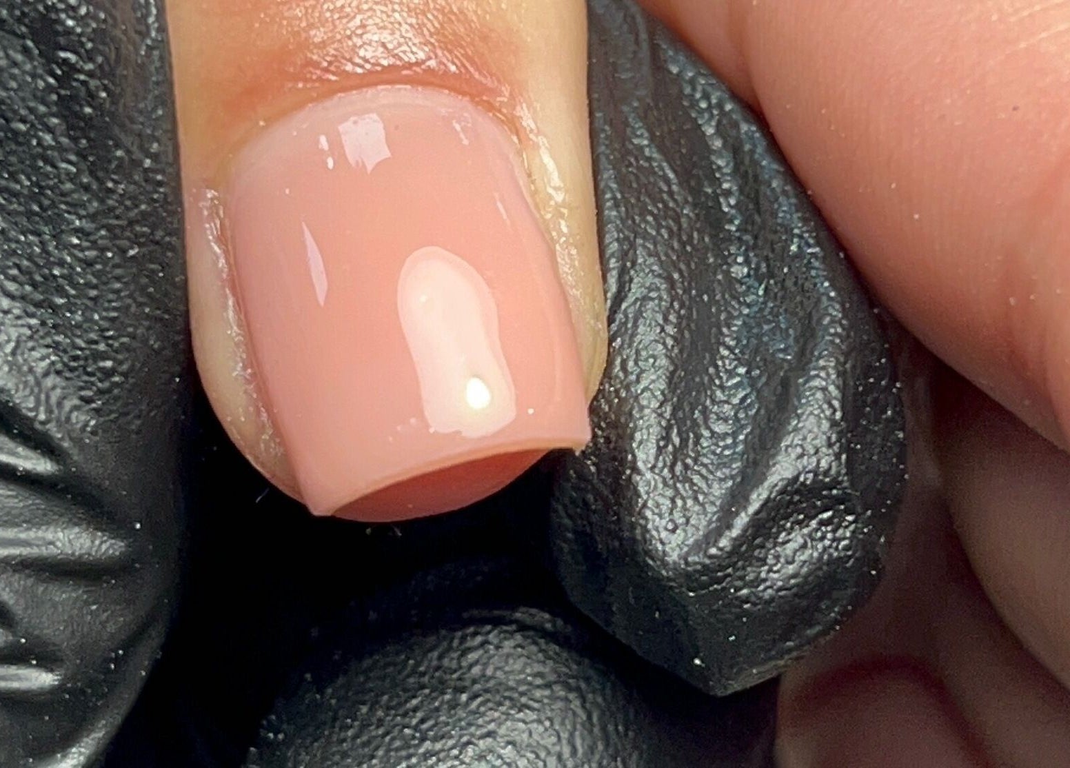 Close-up of a polished nail at Ell Nail Edit, Birmingham, England, GB, showcasing a flawless glossy finish.