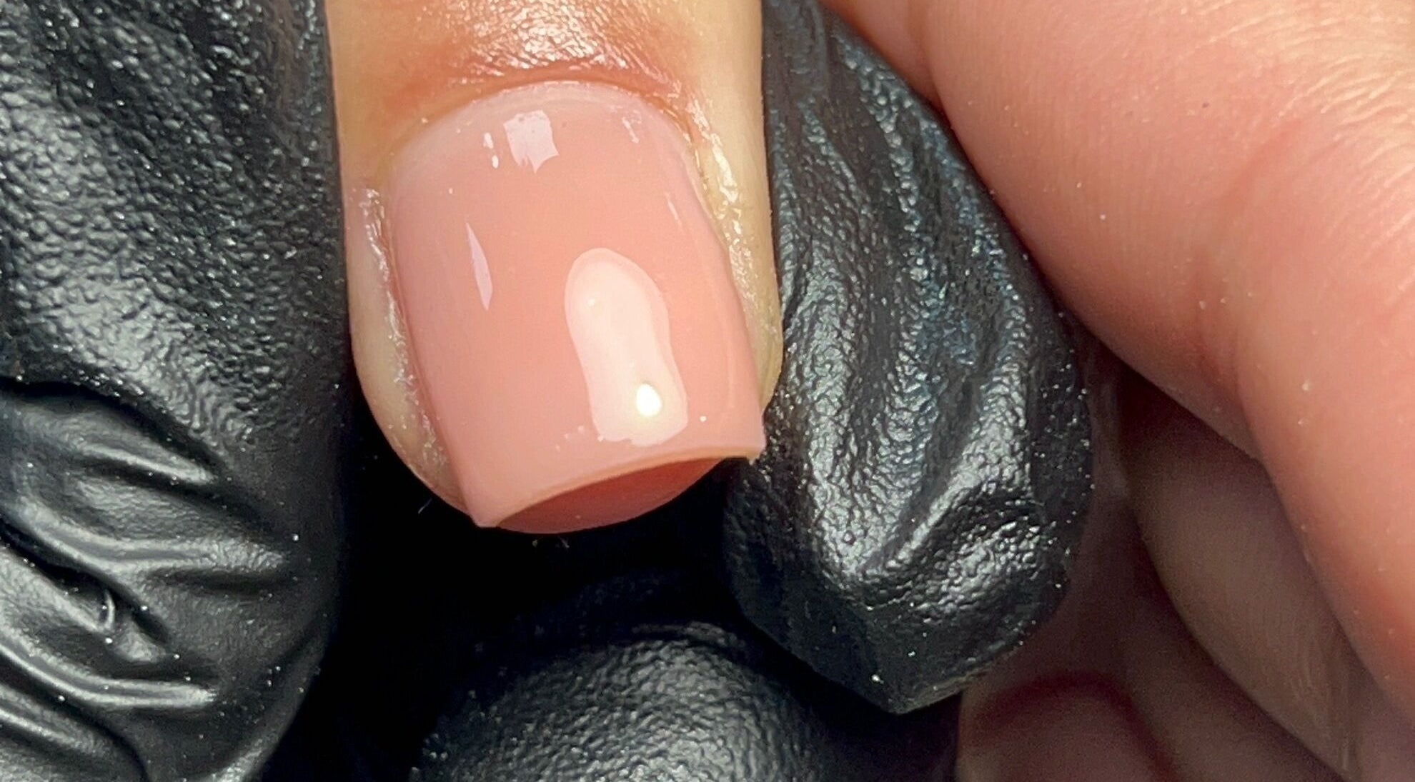 Close-up of a polished nail at Ell Nail Edit, Birmingham, England, GB, showcasing a flawless glossy finish.