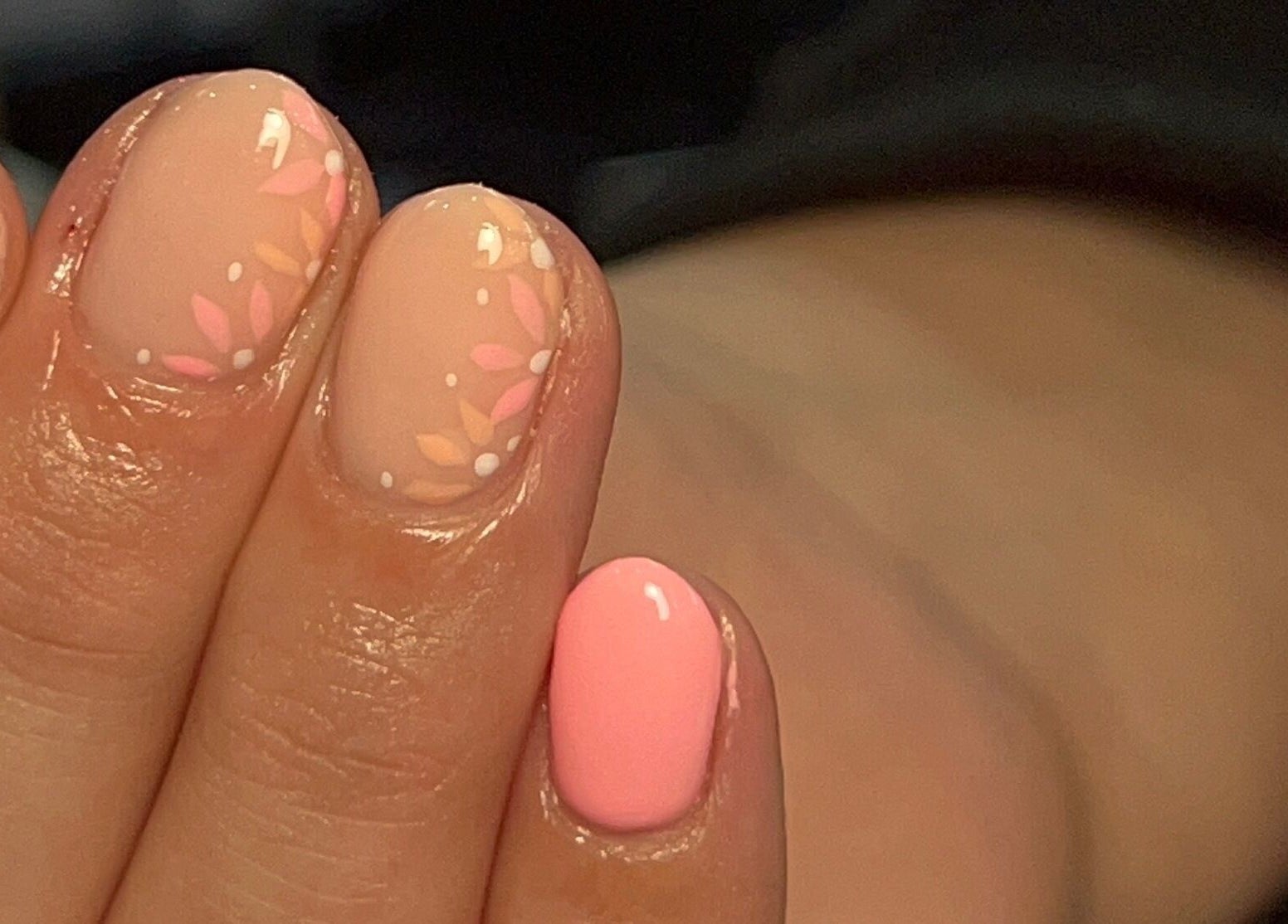 Floral nail art design at Ell Nail Edit in Birmingham, England, GB showcasing pink and nude polish.