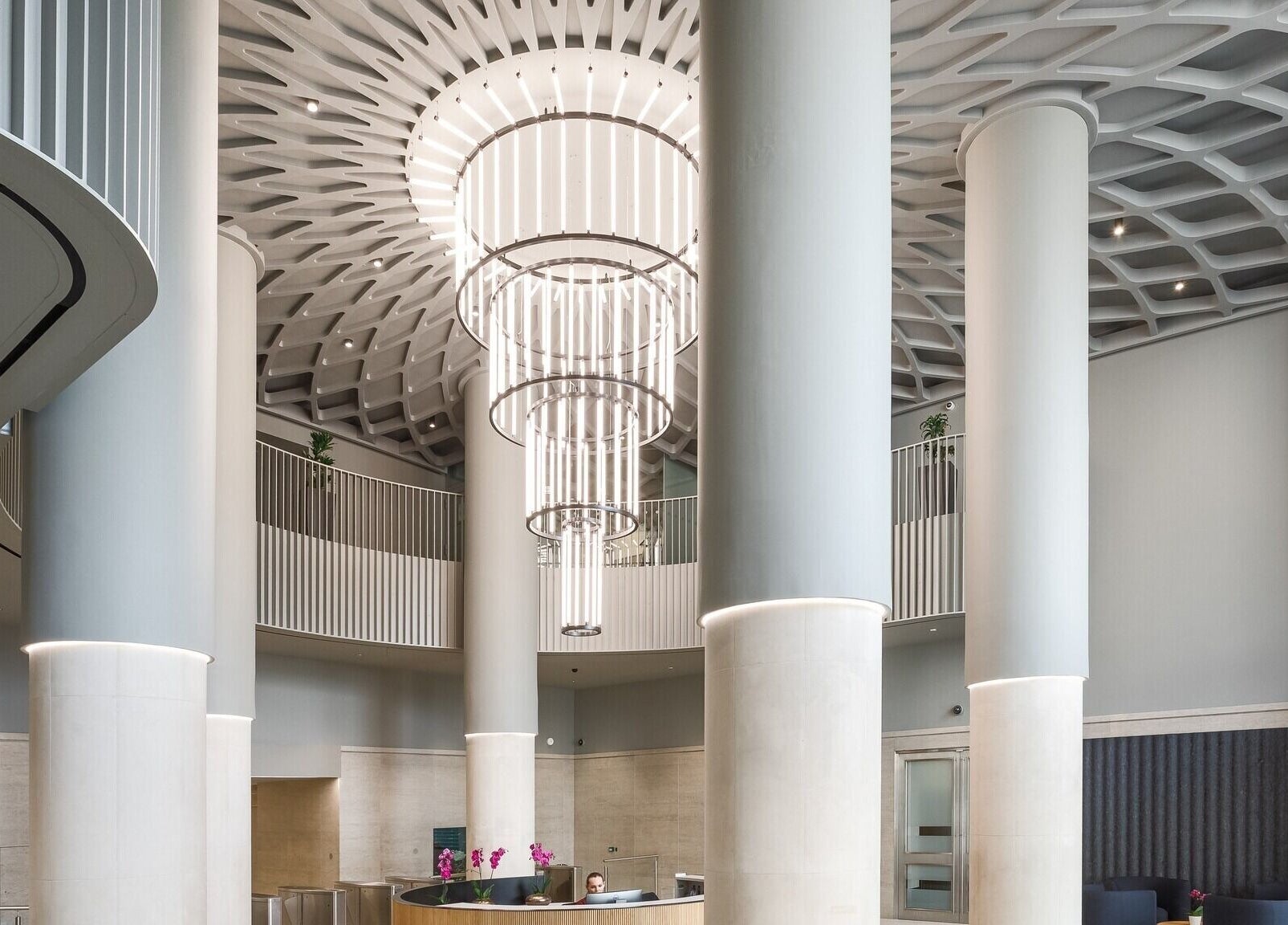 Elegant reception area of Dejavu Lashes in London, England, GB with grand pillars and modern design.