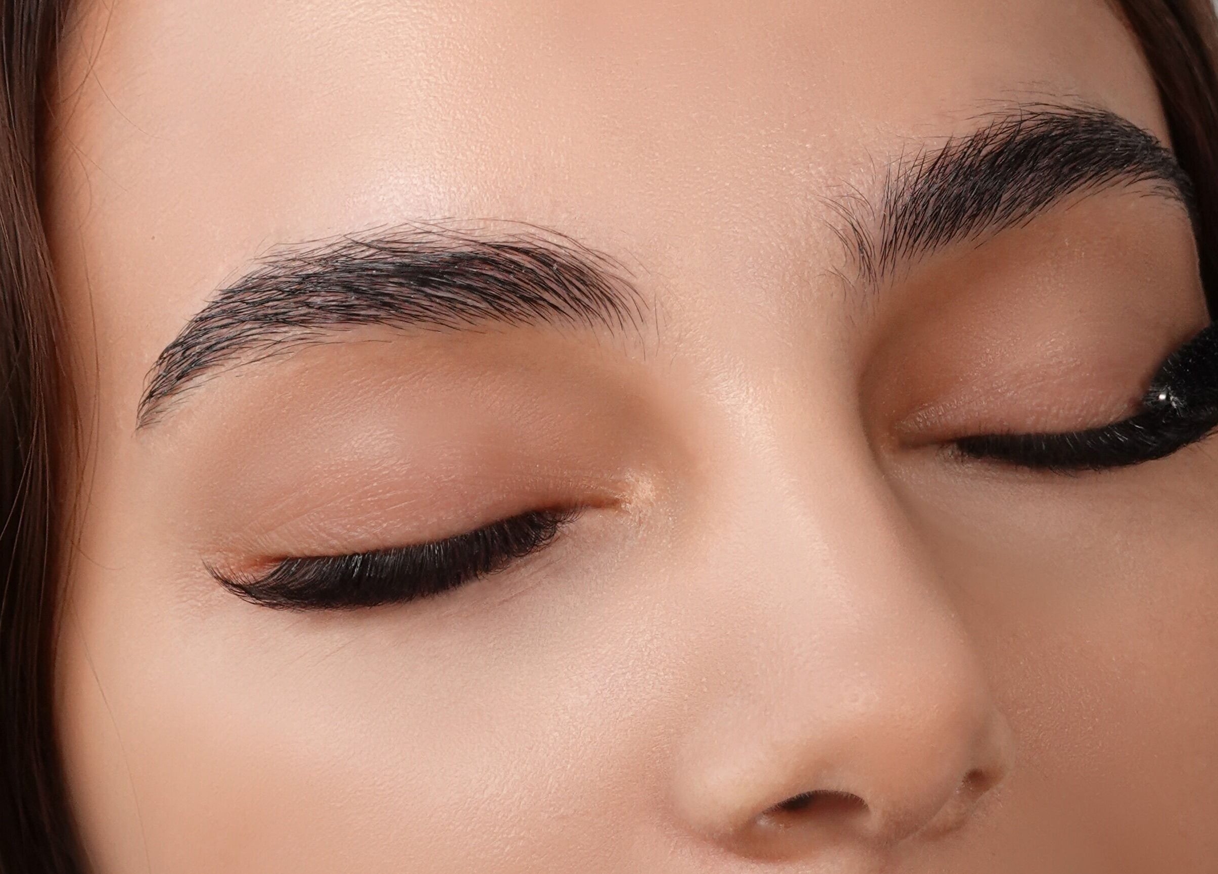 Close-up of eyelash application at Dejavu Lashes, London, England, GB, showcasing expert beauty care.