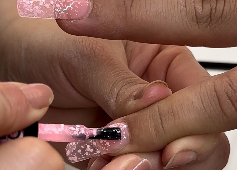 Nail polish application at Koolelo X Get Nailed Academy, Zürich, Zürich, CH showcasing pink sparkle design.
