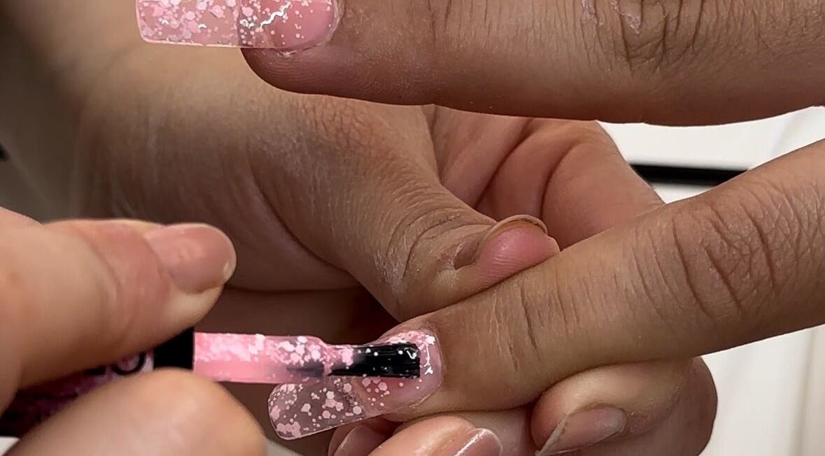 Nail polish application at Koolelo X Get Nailed Academy, Zürich, Zürich, CH showcasing pink sparkle design.